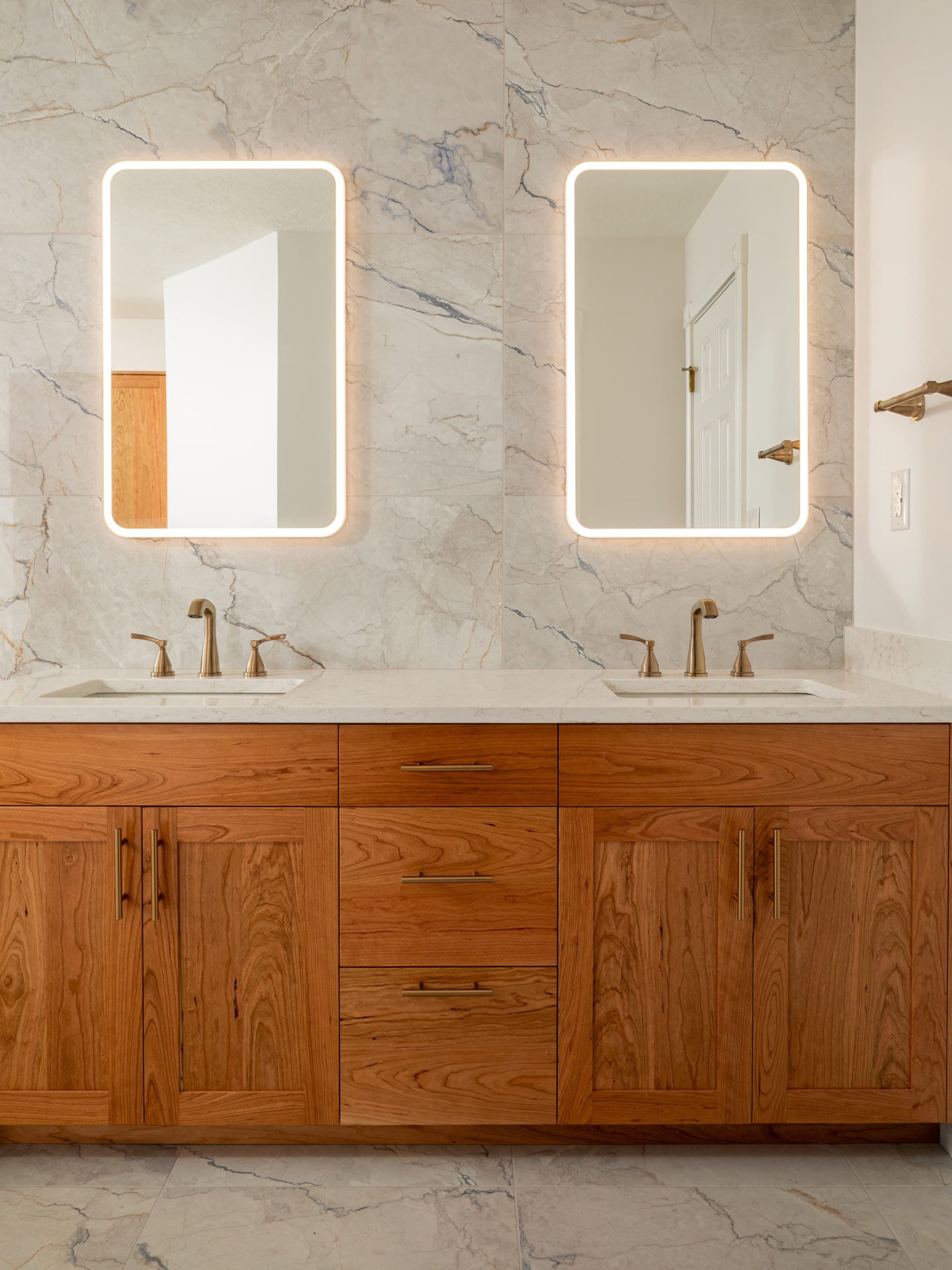 bathroom vanity with lights on mirrors